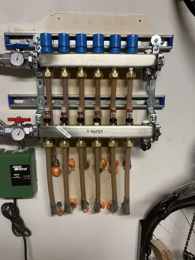 Plumber performing Water Heater Repair at a residential property in Finley